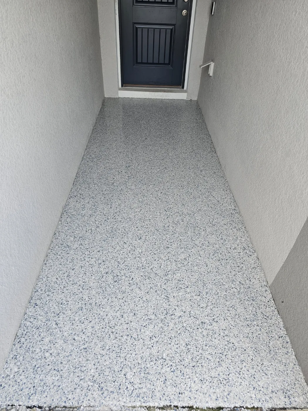 Covered Entryway Epoxy Flake Coating by Elite Epoxy Surfaces, Central Florida