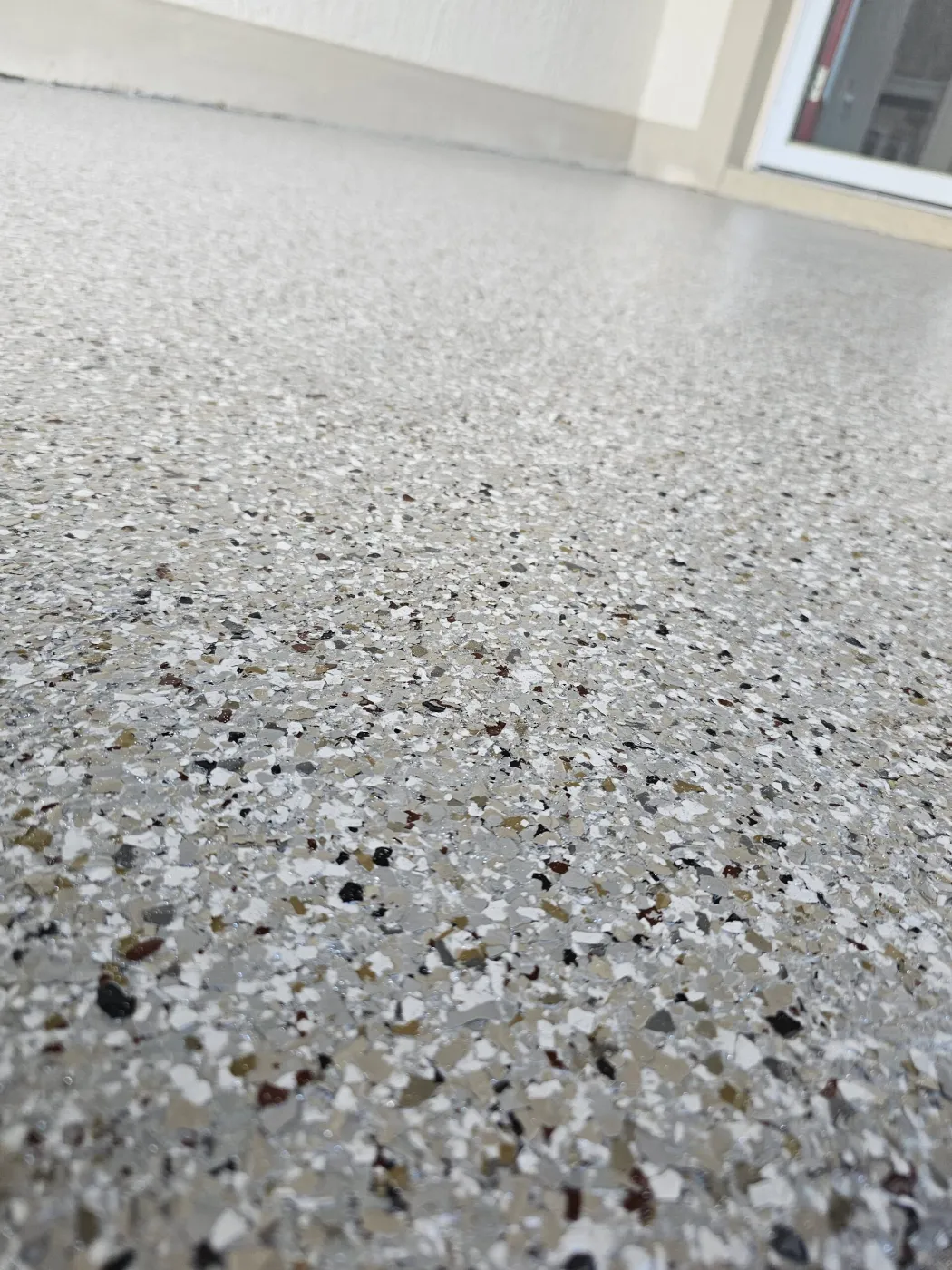 Earth-Tone Flake Patio Coating by Elite Epoxy Surfaces, Central Florida
