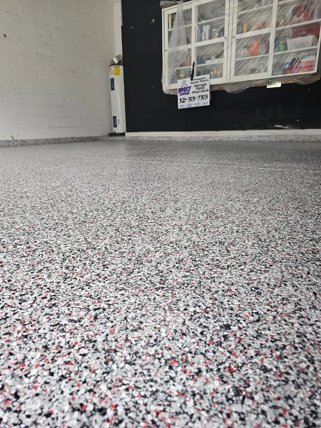 Epoxy Flake Garage Floor Coating with Red Accents by Elite Epoxy Surfaces, Central Florida