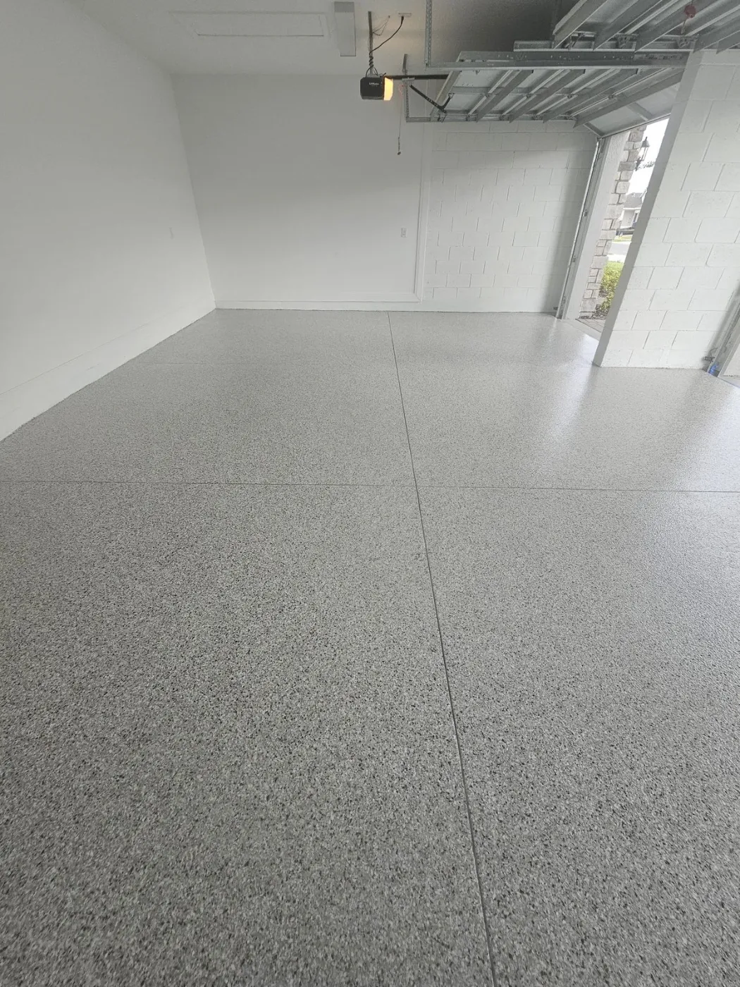 Empty Two-Car Garage Floor Coating by Elite Epoxy Surfaces, Central Florida