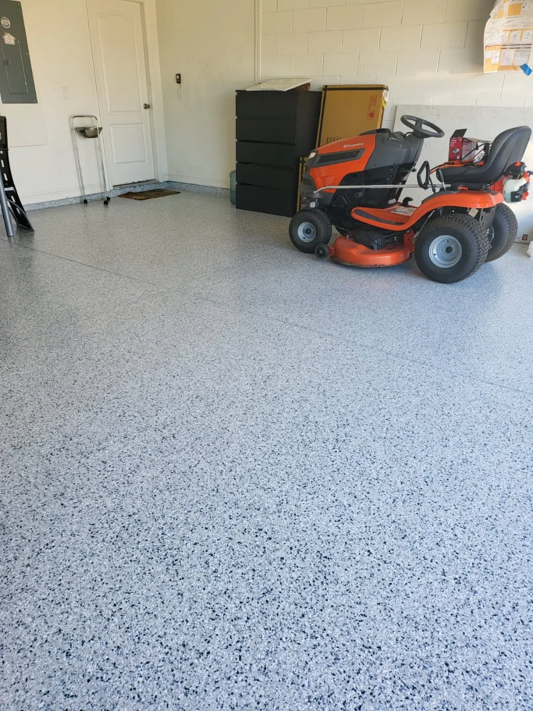 Garage Mower & Storage Floor Coating by Elite Epoxy Surfaces, Central Florida