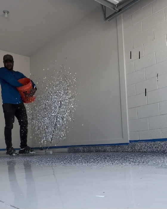 Professional concrete coating application on a residential garage floor in Florida