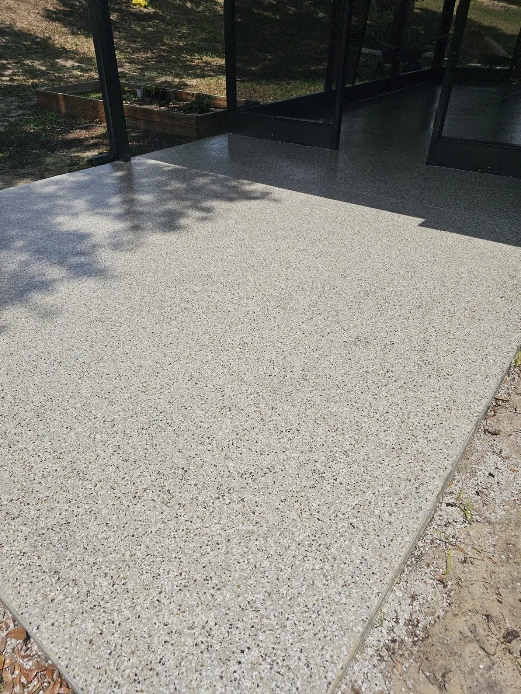 Screened Lanai Garden-View Patio Coating by Elite Epoxy Surfaces, Central Florida
